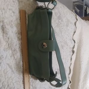 Woman light blue Hype adjustable soulder/hand strap inside zippered pocket used